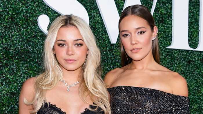 Olivia Dunne and Olivia Ponton pose for the camera in black floor-length gowns.